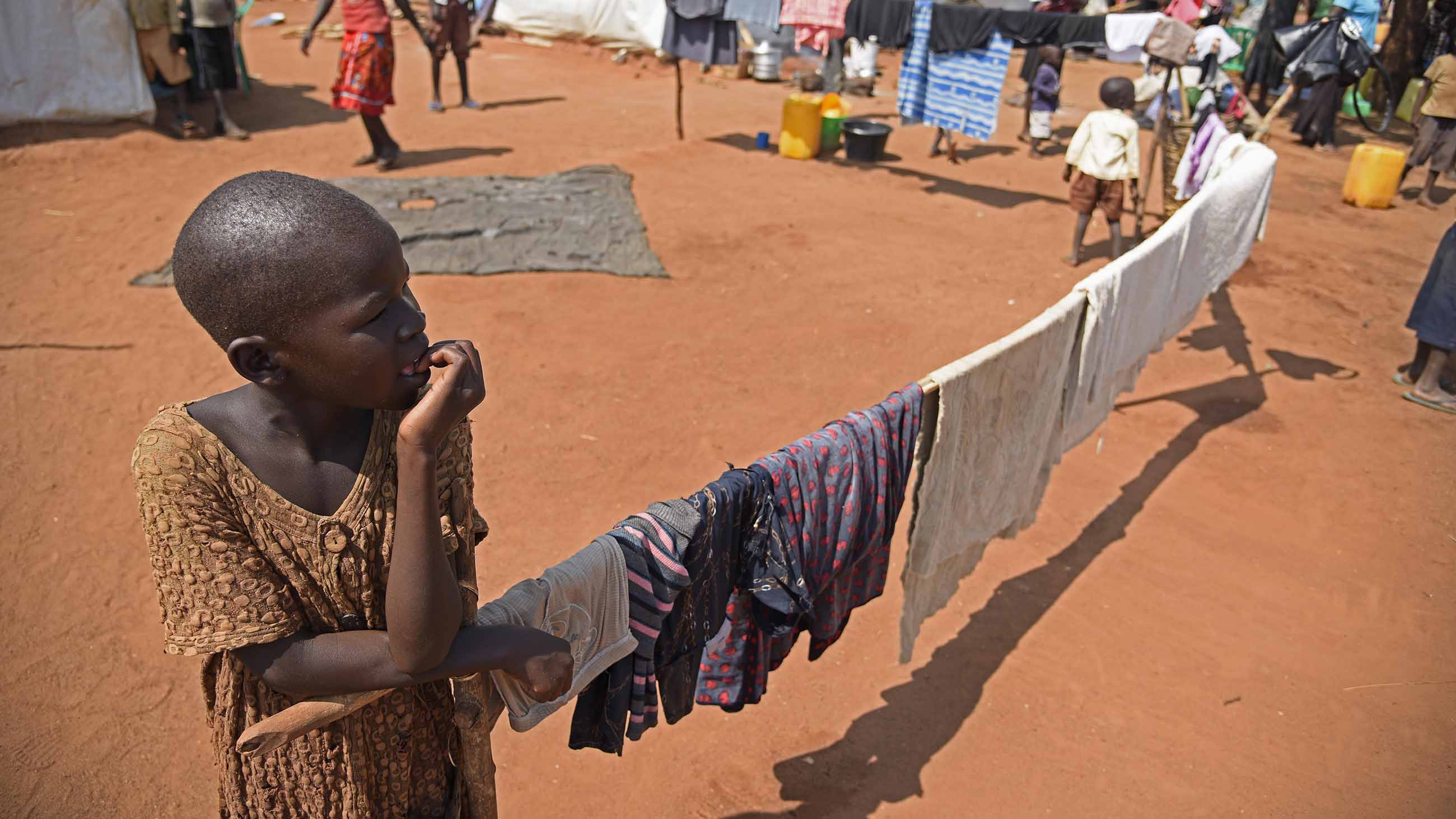 A South Sudanese refugee boy lingers on a hot afternoon in the Pagirinya refugee settlement in Uganda.