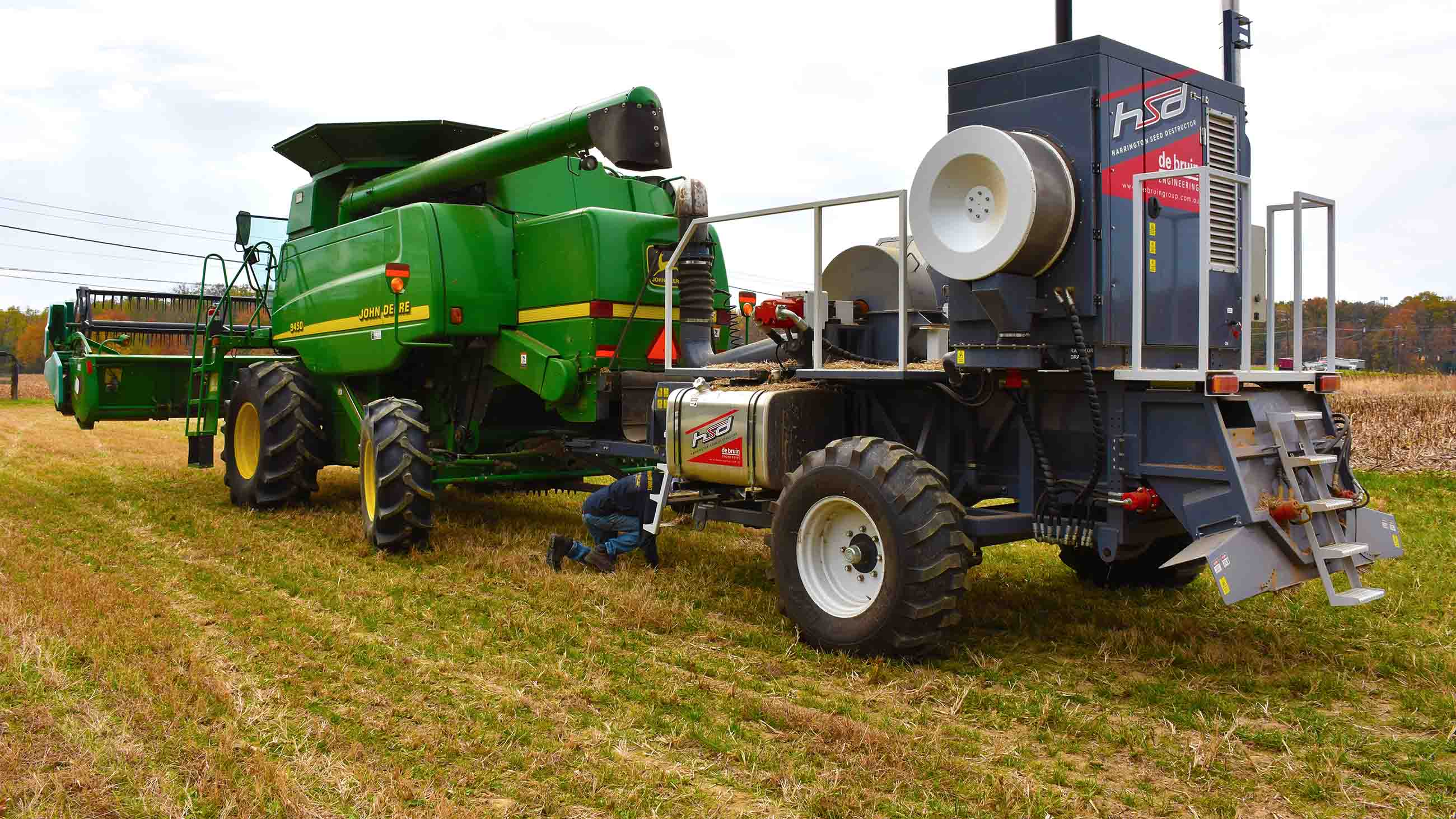 The Harrington Seed Destructor attached to the rear of a combine, in preparation for soybean harvest.