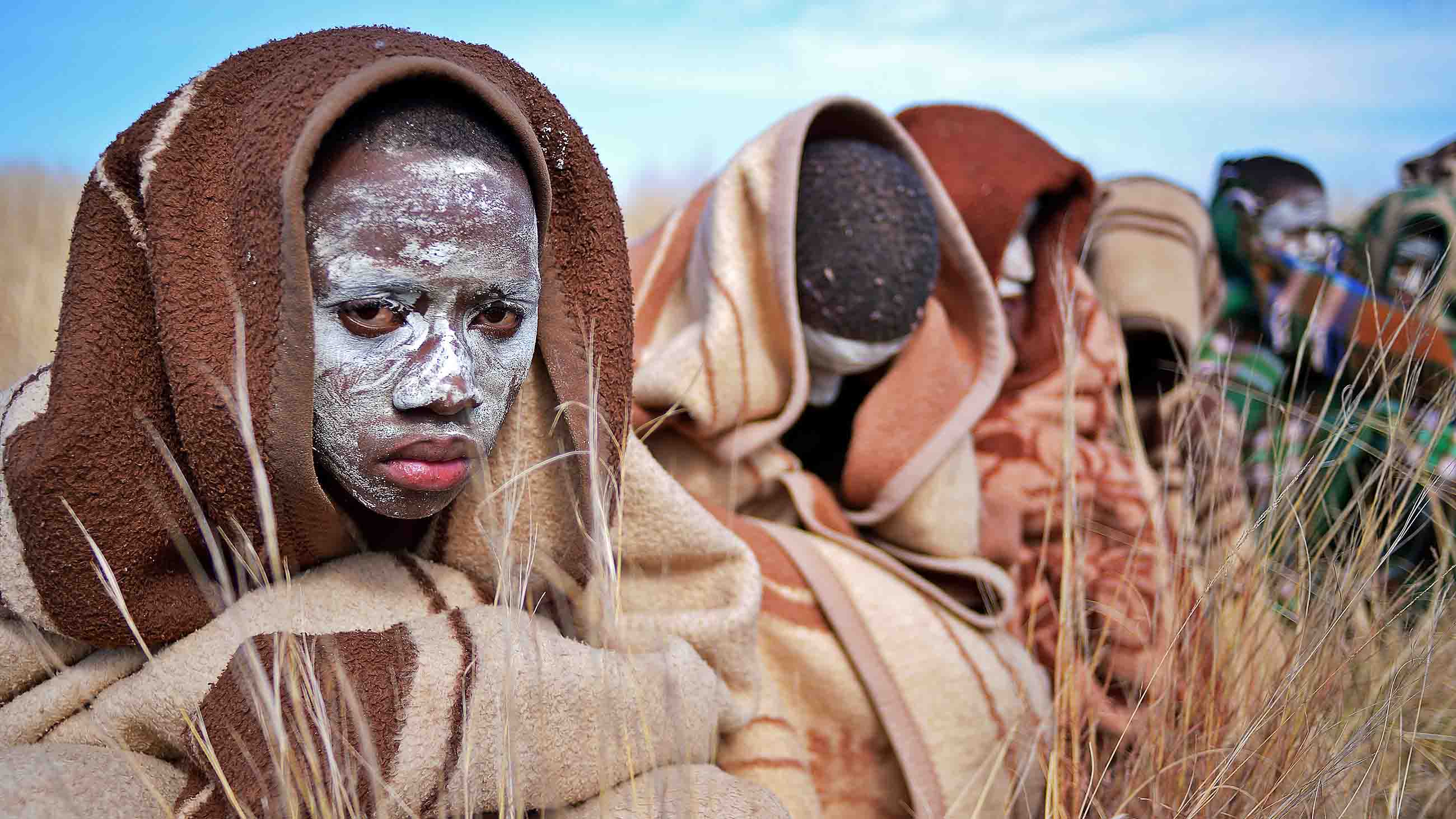 Boys from the Xhosa tribe who have undergone a circumcision ceremony sit near Qunu on June 30, 2013.