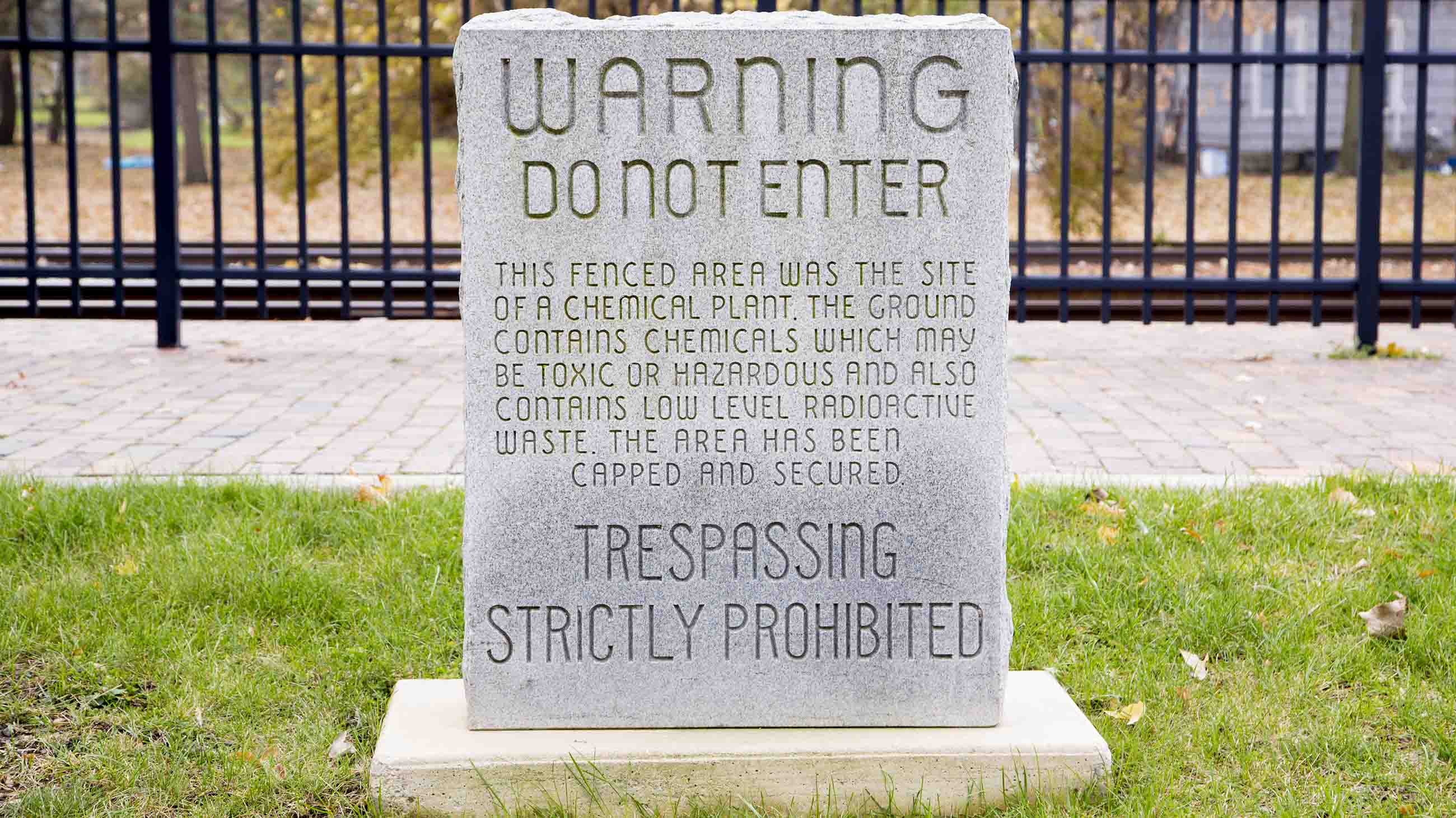 A headstone that once warned visitors away from the entrance to the former Michigan Chemical Corporation site in St. Louis, Michigan.