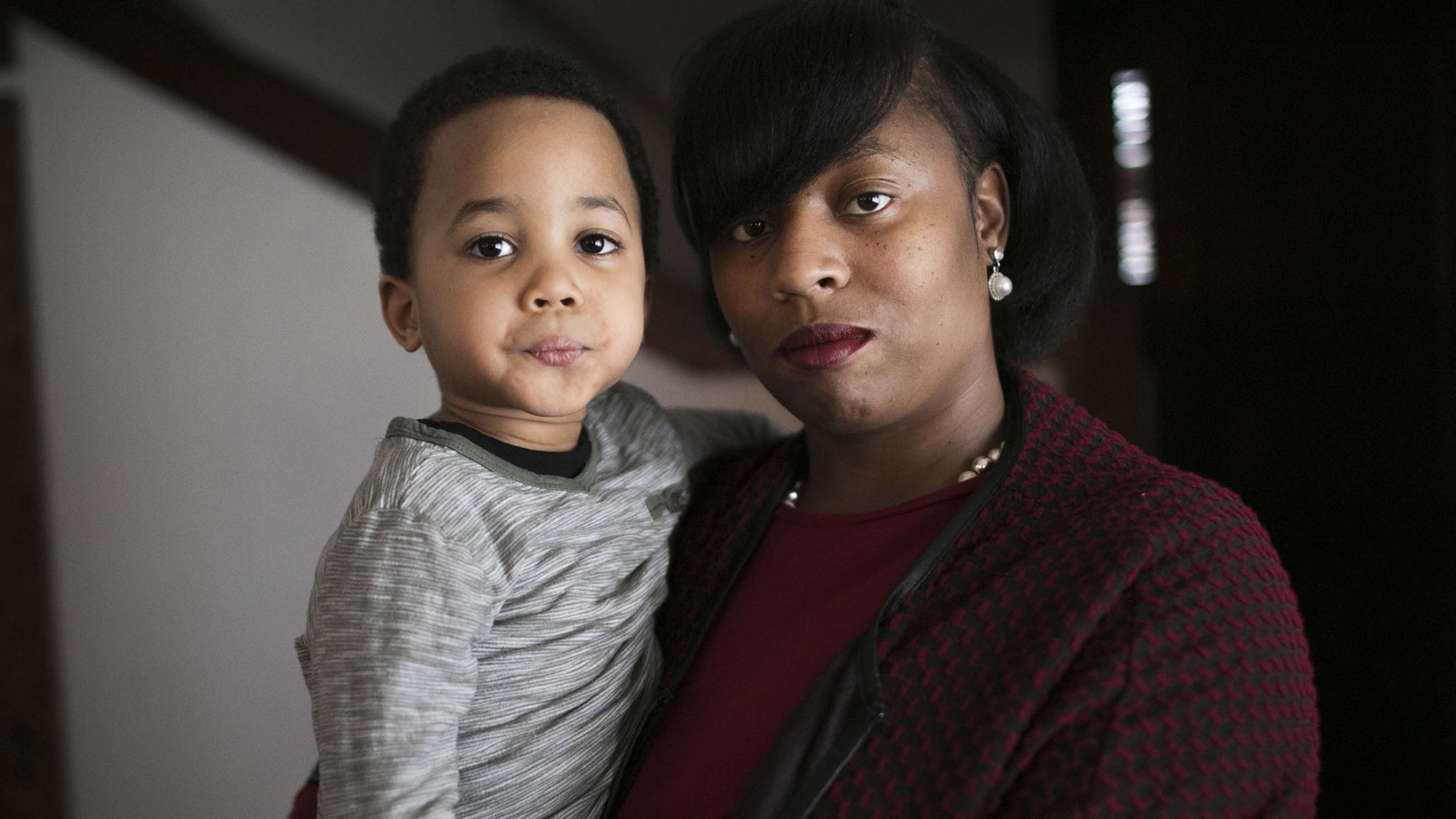 Shecara Norris stands with her son Michael in Columbus, Ohio on February 17, 2018. Michael had a blood lead level of 30 mcg/dL when he was 2 years old.