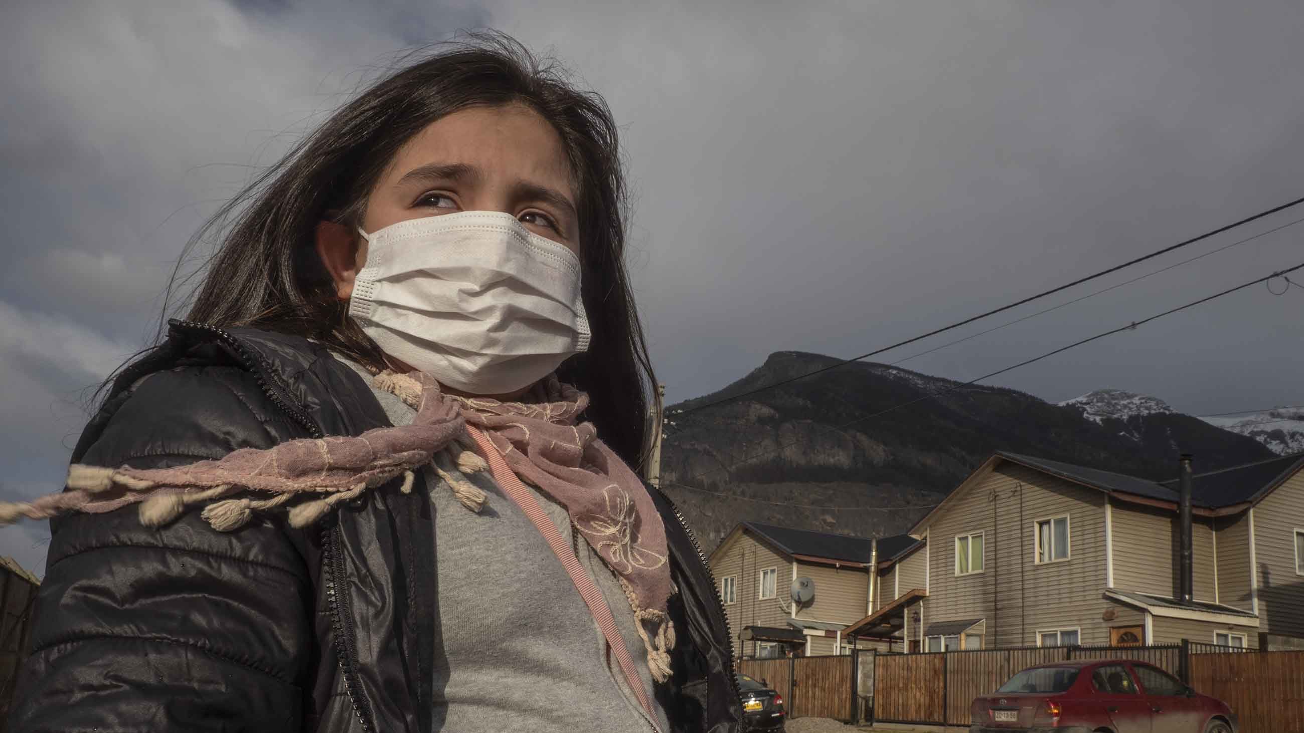Natalie Galindo, 10, has severe asthma and most trips outside her home in the town of Coyhaique involve wearing a mask — or even a respirator.