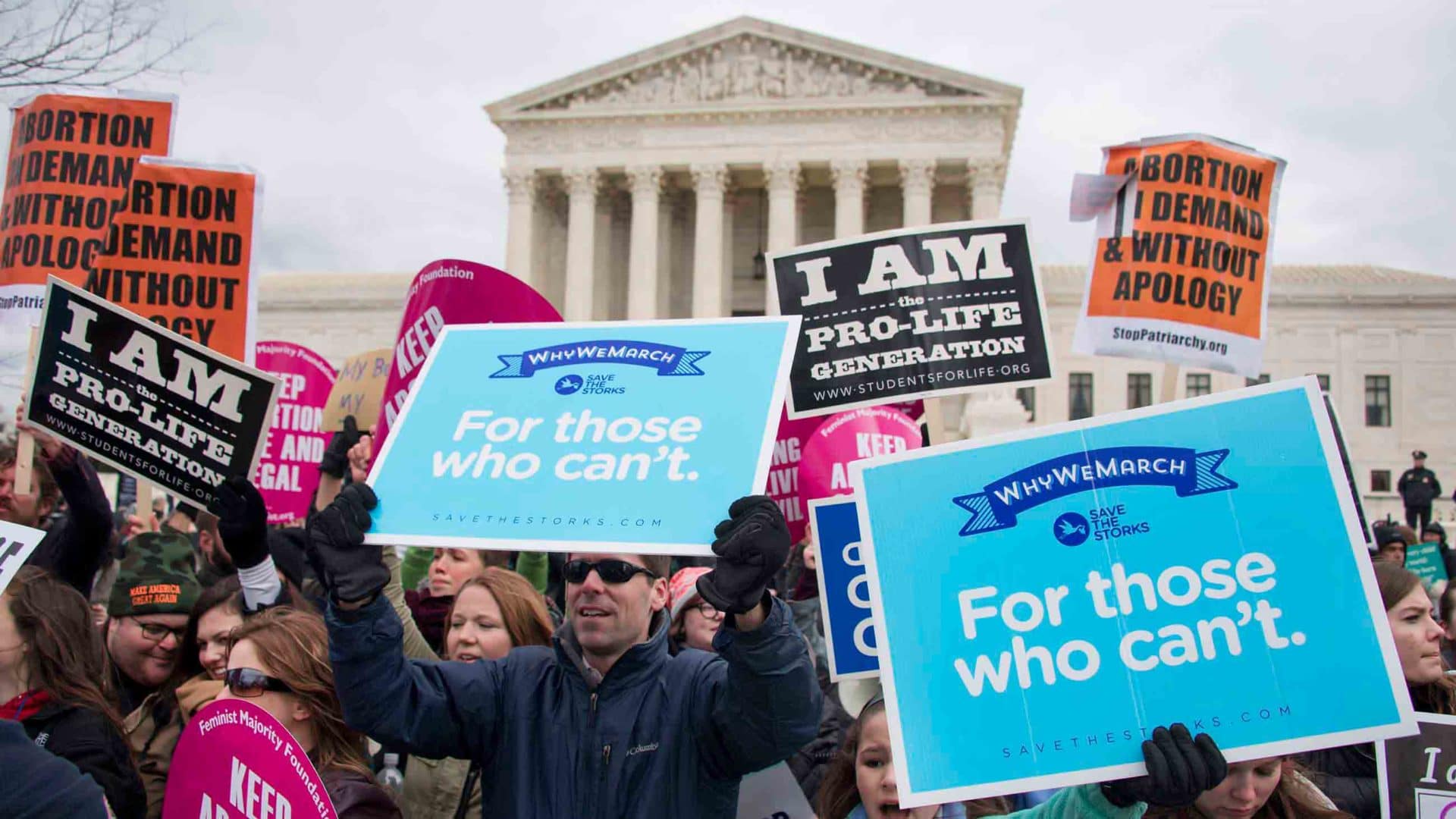 Anti-abortion activists demonstrate in front of abortion activists as they intermix during a demonstration in front of the US Supreme Court during the March For Life in Washington, D.C., on January 27, 2017.
