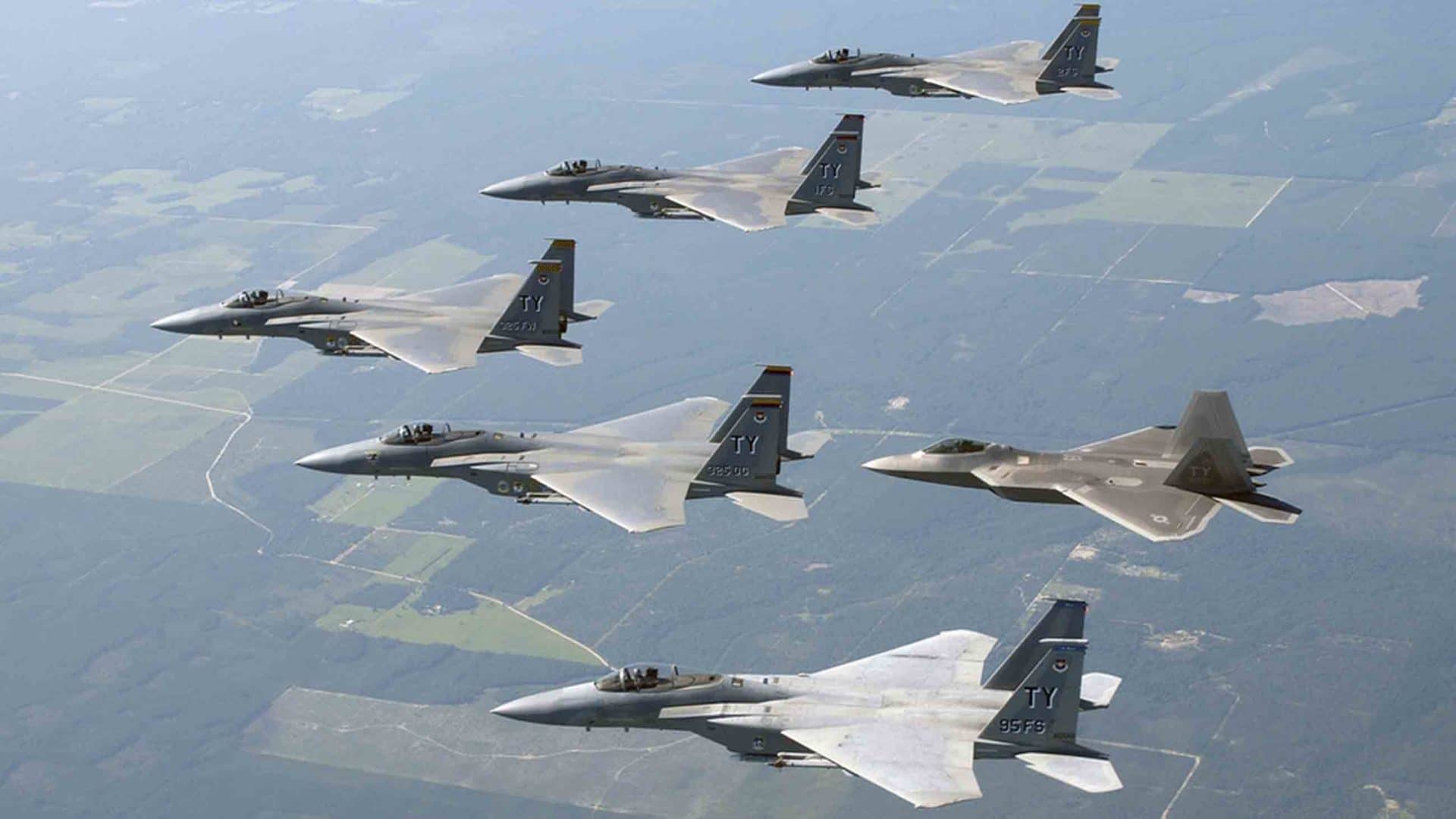 U.S. military aircraft fly in formation