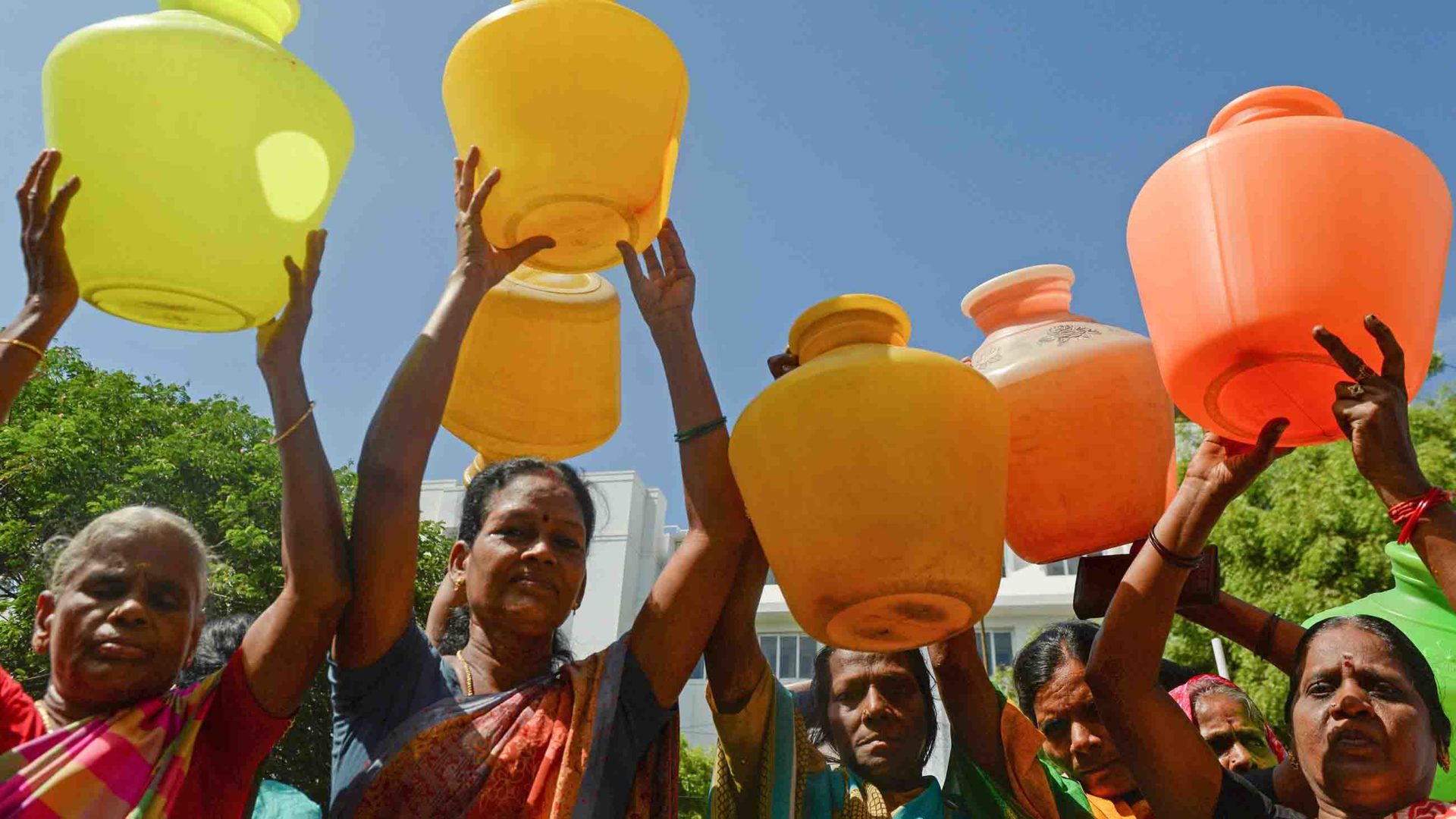 Indian women with empty plastic pots protest as they demand drinking water in Chennai on June 22, 2019.