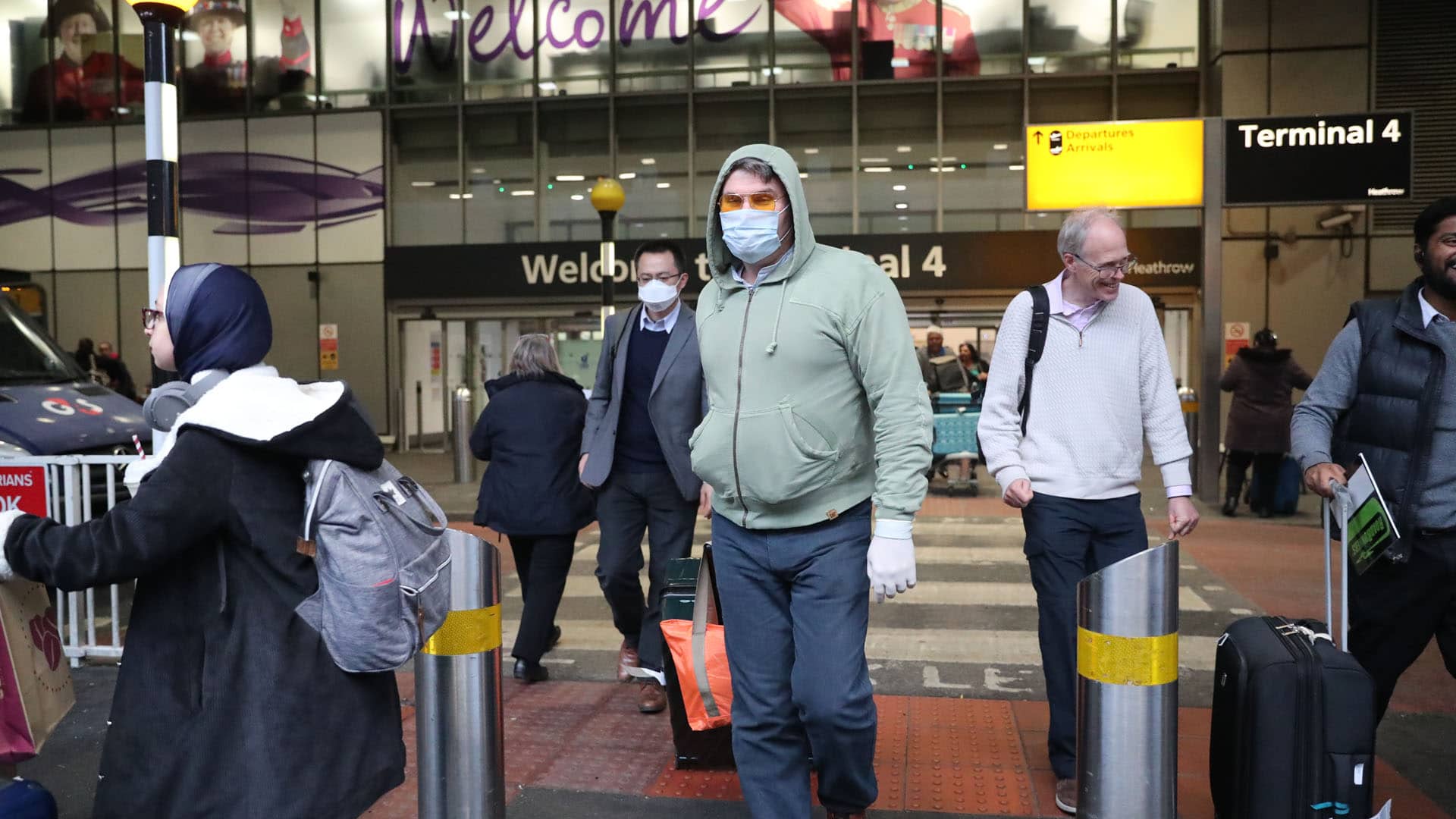 Passengers outside of Terminal 4 at London's Heathrow Airport in January as government officials meet to discuss the threat to the U.K. from coronavirus.