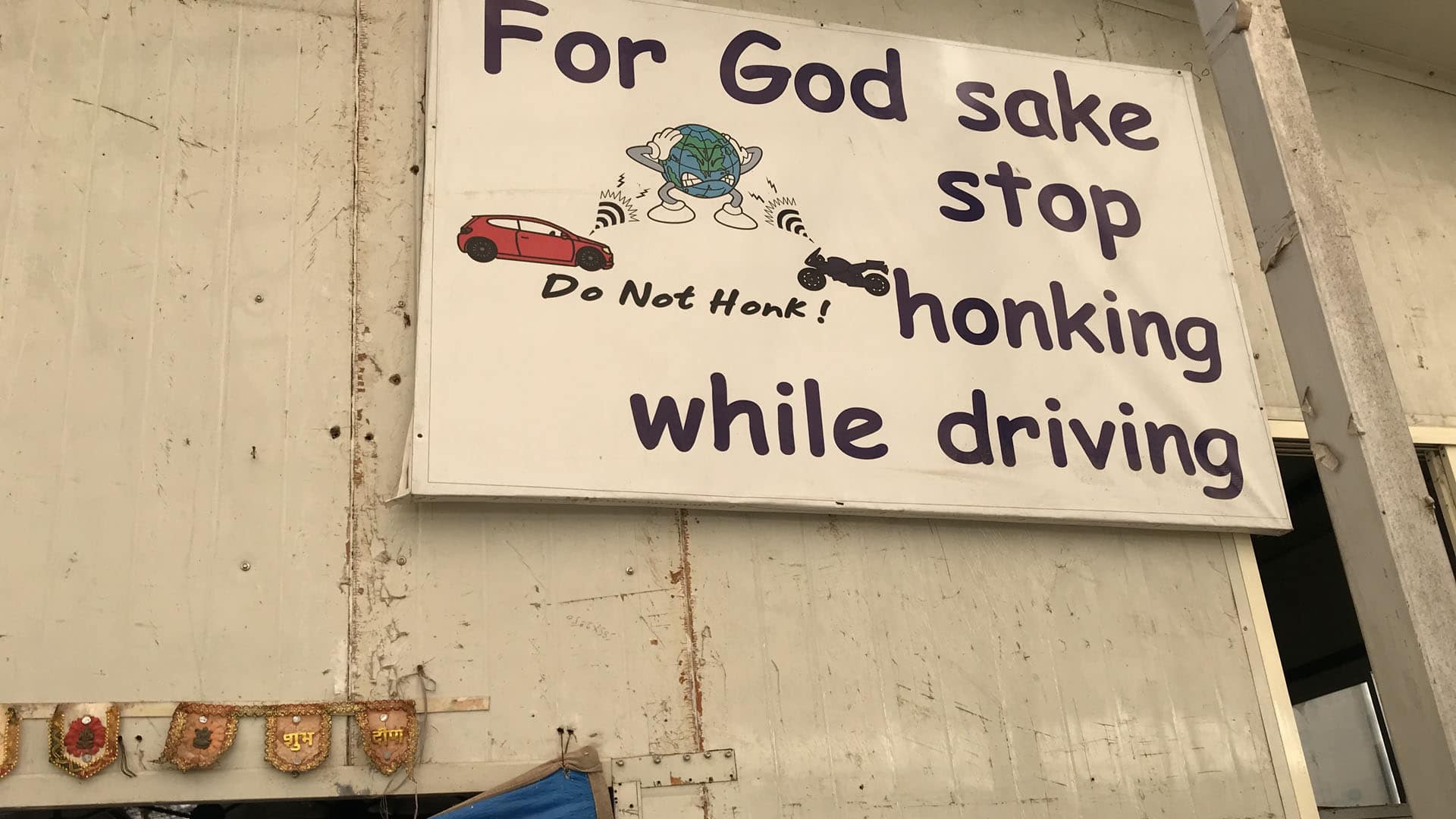 An anti-honking sign hangs on the wall at the Earth Saviours Foundation just outside New Delhi. The foundation is active in caring for the homeless and several environmental causes, including noise pollution.