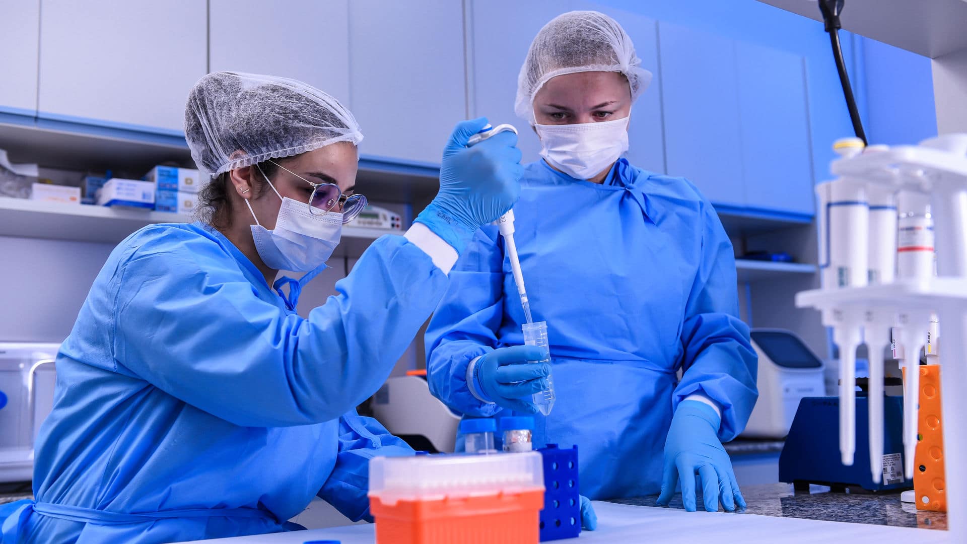Biomedic Andressa Parreiras and biologist Larissa Vuitika extract genetic material from the SARS-CoV-2 virus on March 24, 2020 in Belo Horizonte, Brazil.