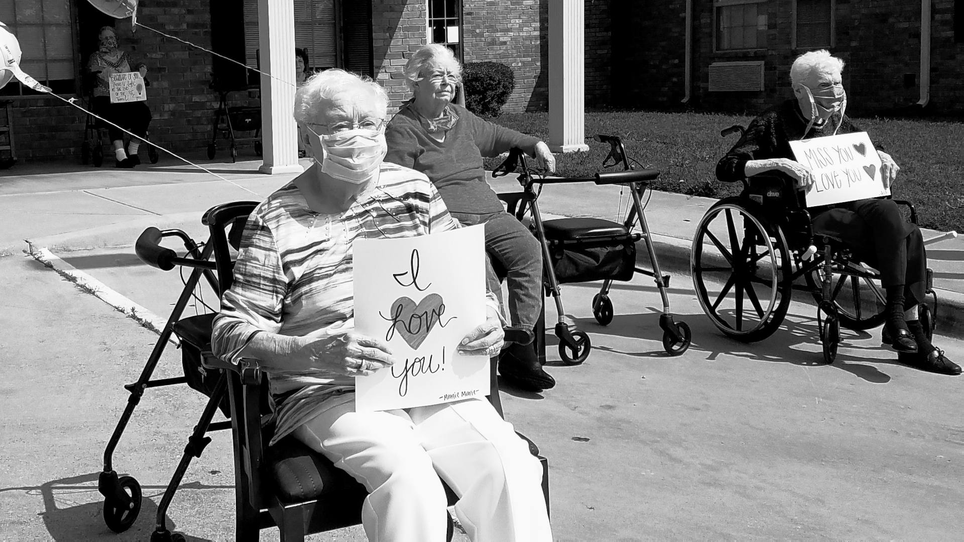 Residents of a nursing home on a group "outing" in mid-May gathered outside their facility as family and friends drove around the building, cheered, and played music.