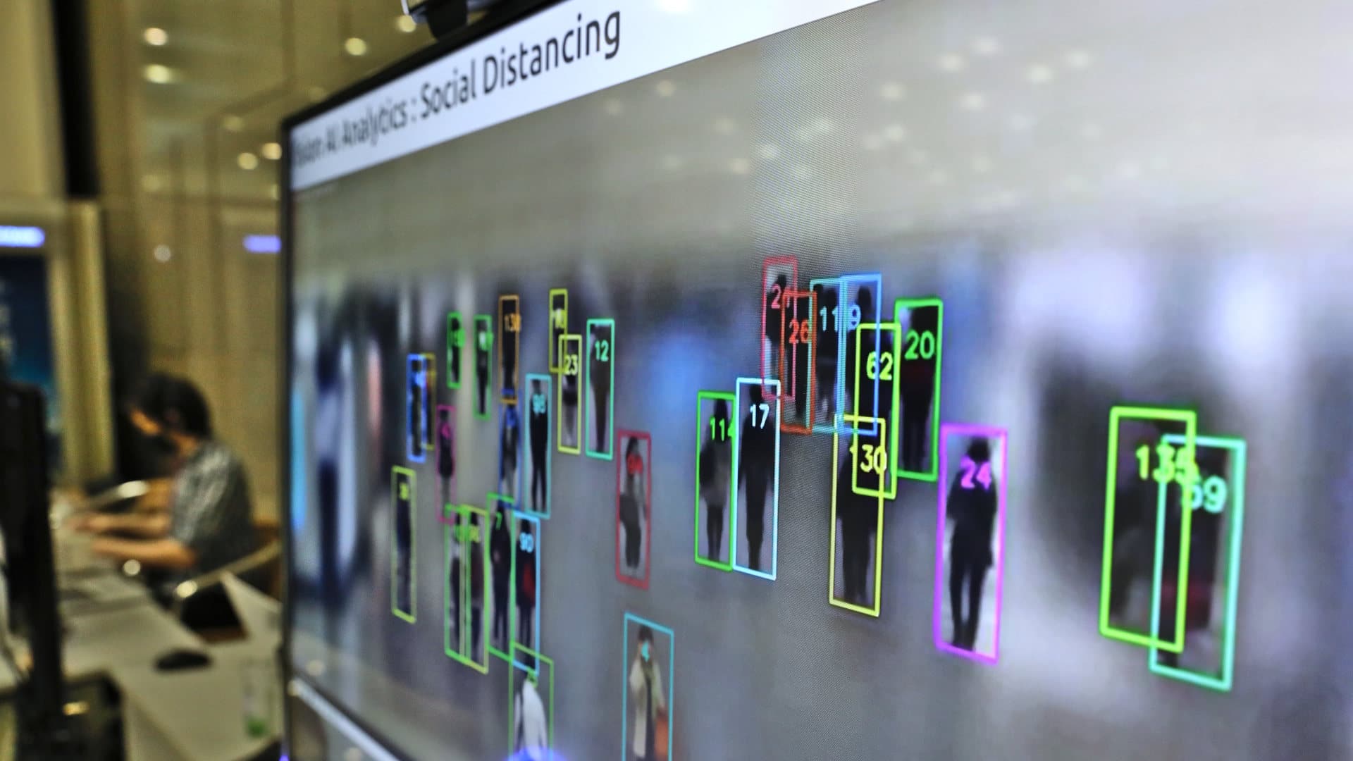 Object detection and tracking technology for people not wearing masks, developed by SK Telecom, is displayed on a screen at the company headquarters on May 26, 2020 in Seoul, South Korea.