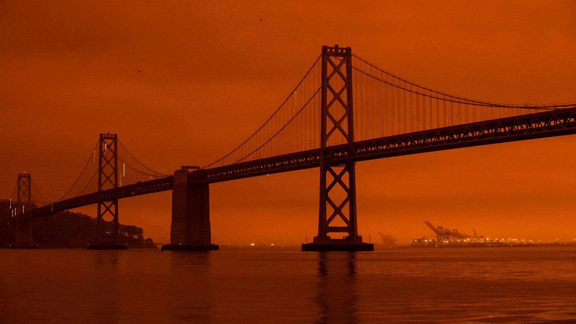 Smoke from wildfires burning across Northern California blankets San Francisco in a dark, orange glow on September 9, 2020.