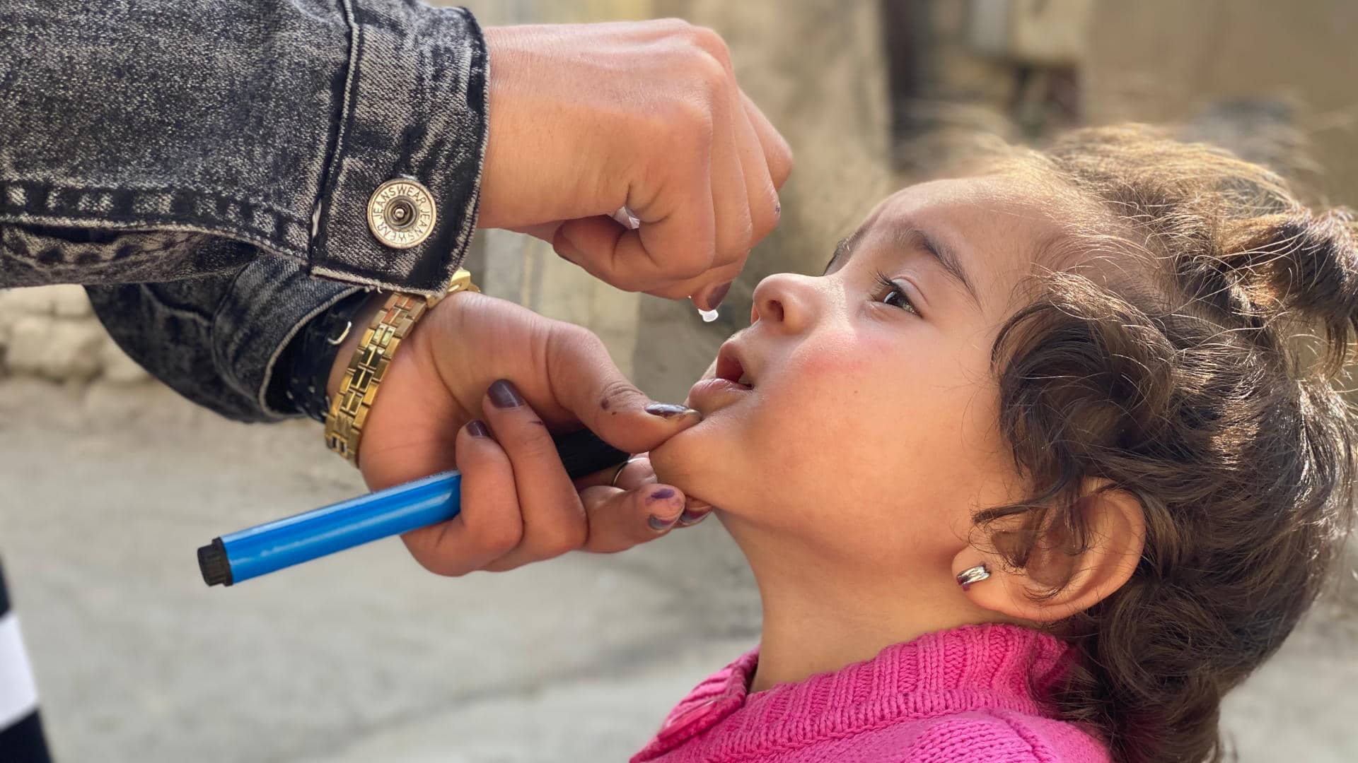 In February, the Covid-19 pandemic halted polio immunization campaigns across Afghanistan and Pakistan, fueling a new resurgence of polio in children. Here, a young girl is given the polio vaccine in the Kabul Province in October after campaigns were resumed.