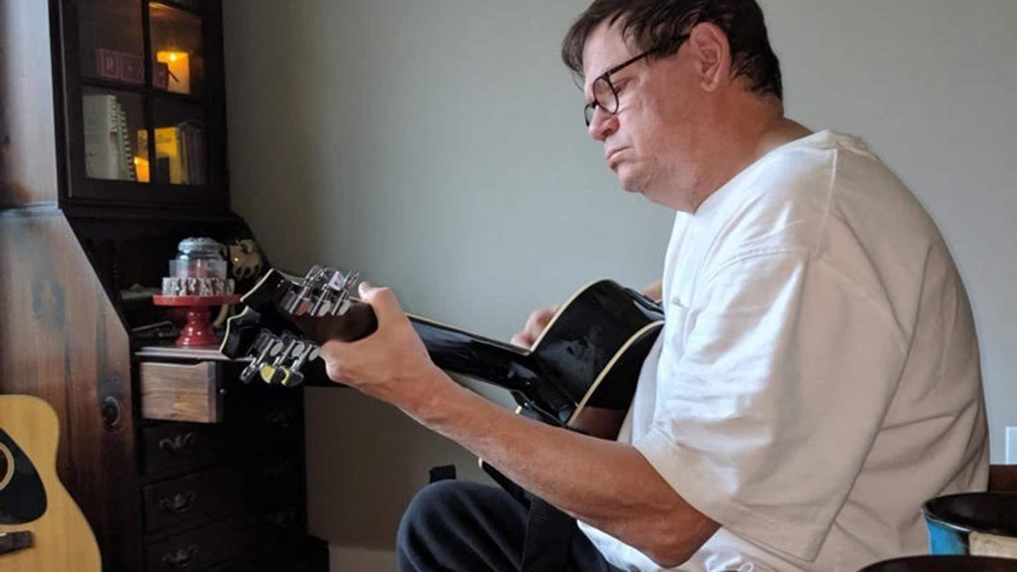 Tenino, Washington police chief Bob Swain playing guitar at home in June. Earlier in the year he was told his kidneys were failing and dialysis was necessary. But he had other plans.