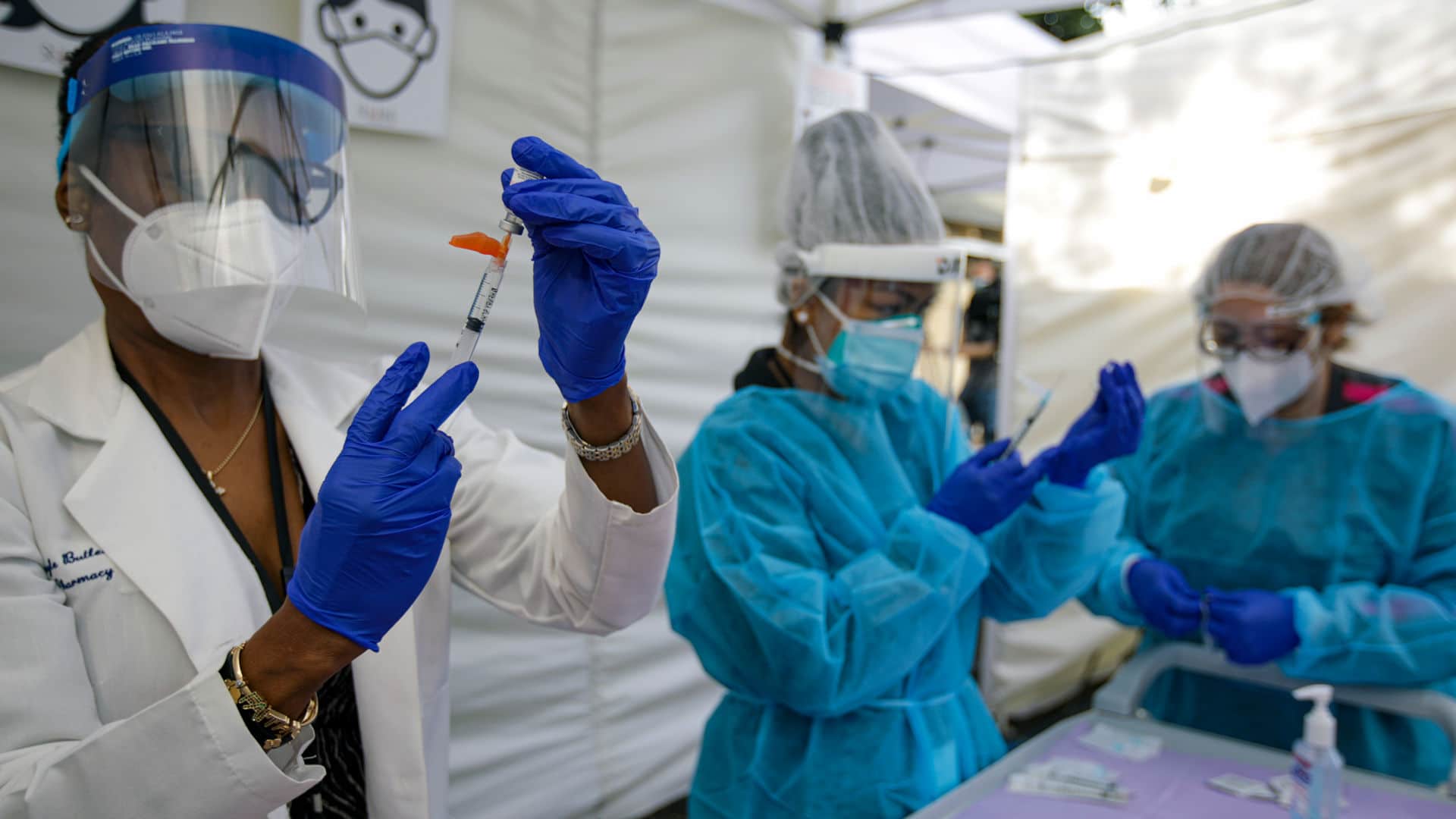 Health care workers prepare the Pfizer-BioNTech Covid-19 vaccine in Los Angeles this January.