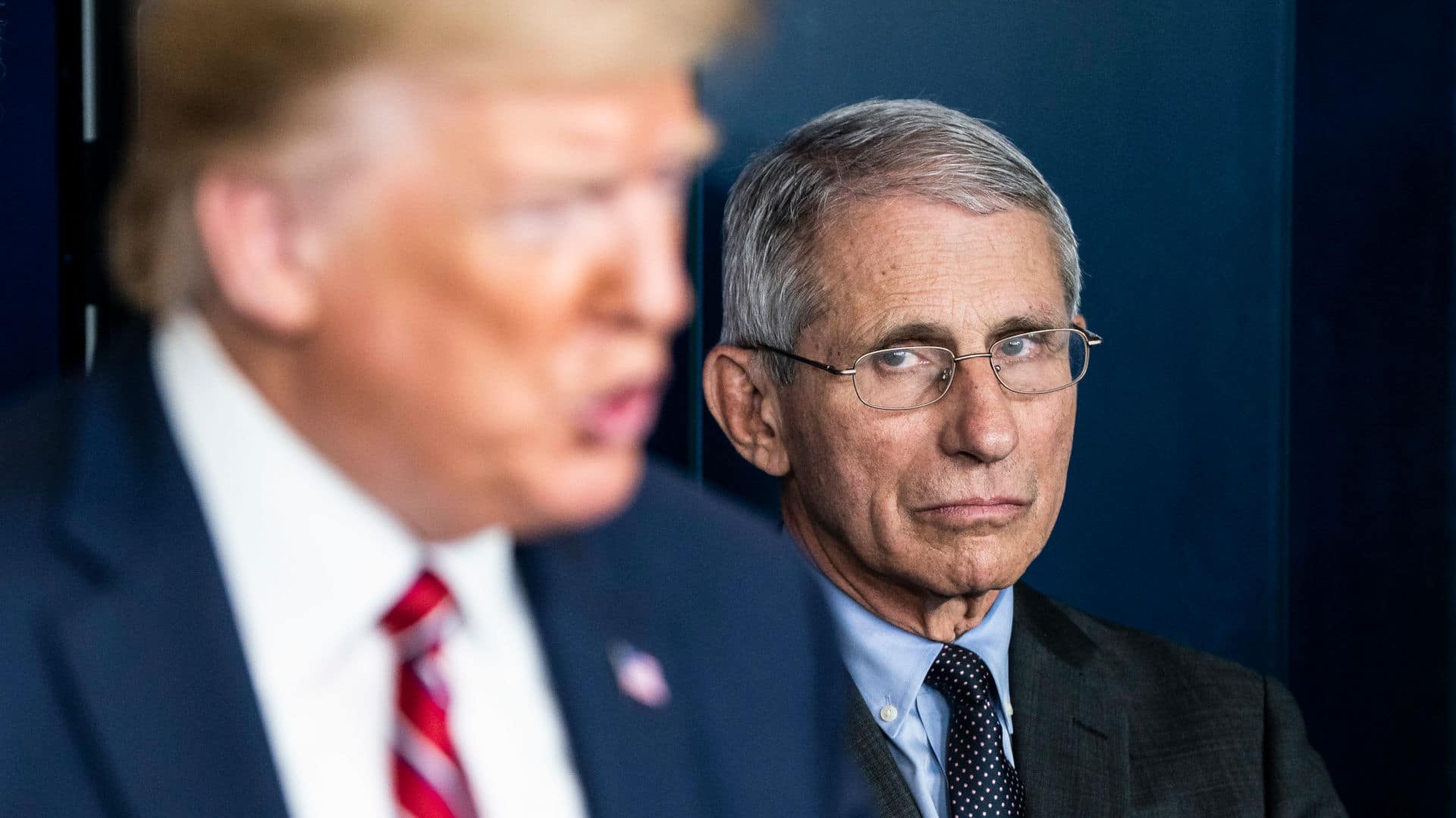 Anthony Fauci, National Institute for Allergy and Infectious Diseases Director, listens as then-President Donald Trump speaks with the coronavirus task force in March 2020.