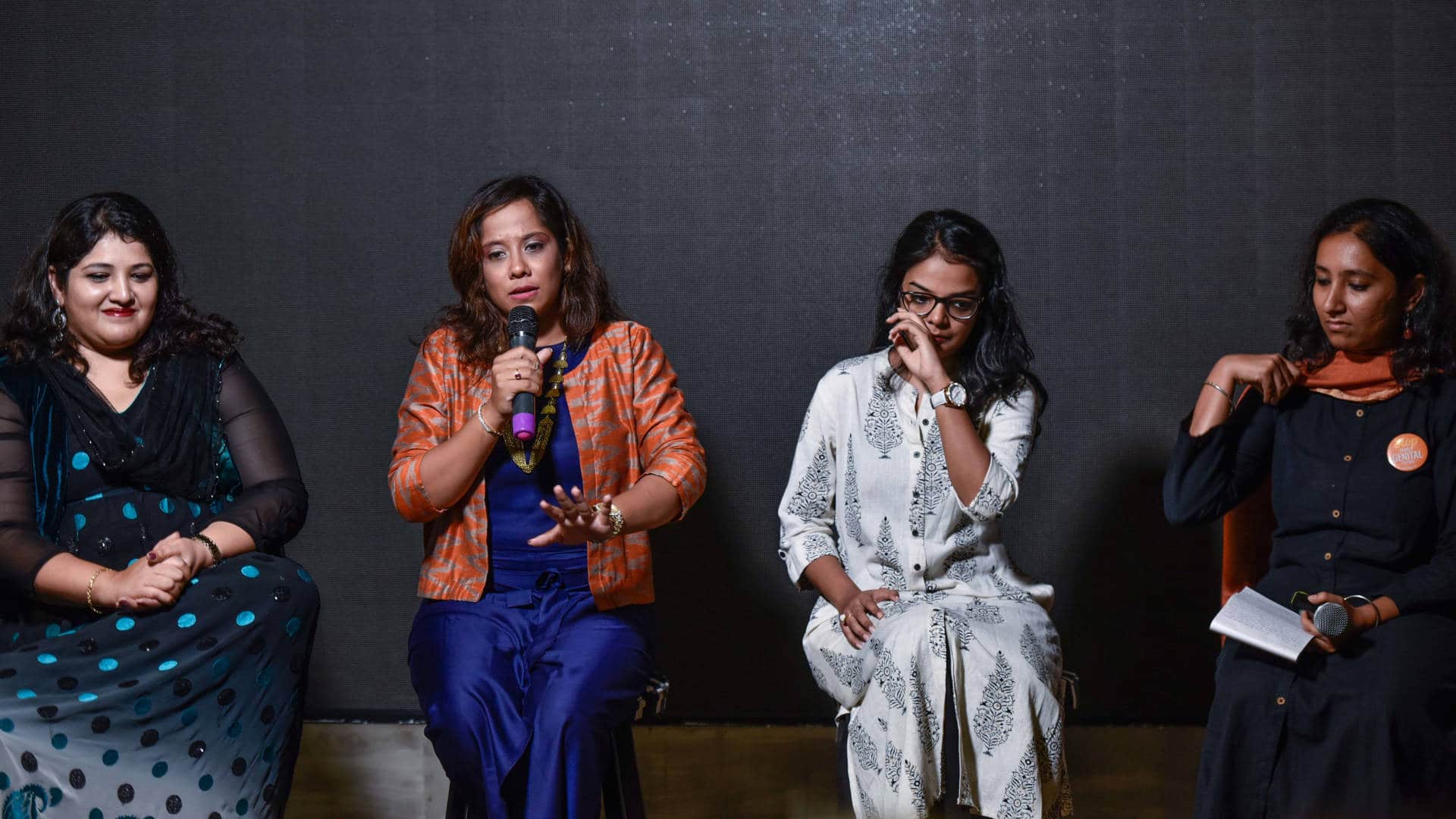 Aarefa Johari, far right, along with other survivors of female genital mutilation, speaks about her experience at a public forum in Mumbai in 2018. From left to right, the other speakers are Insiya, Samina, and Fatema.