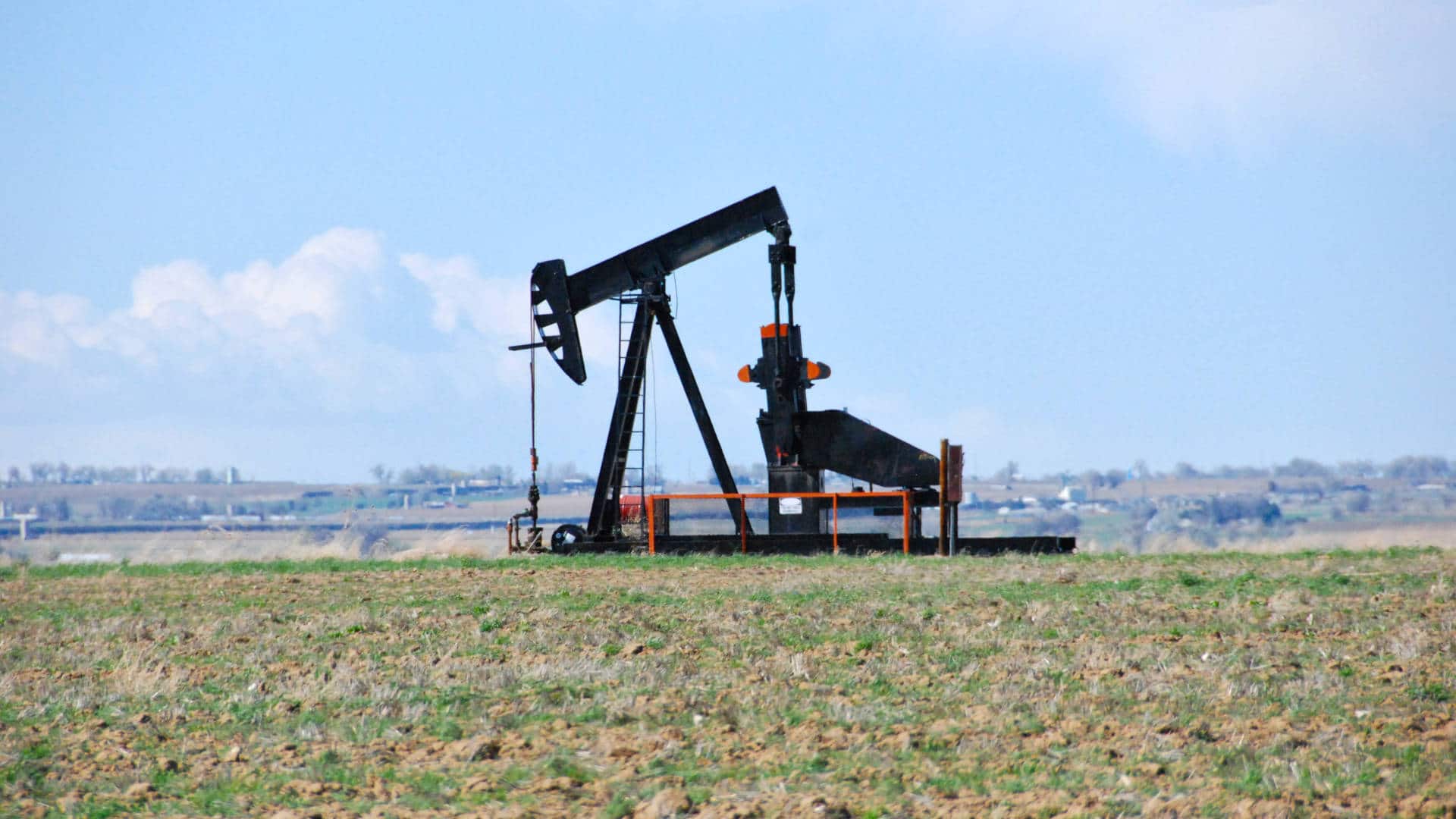 A pump jack extracts oil from a well near Johnstown, Colorado.