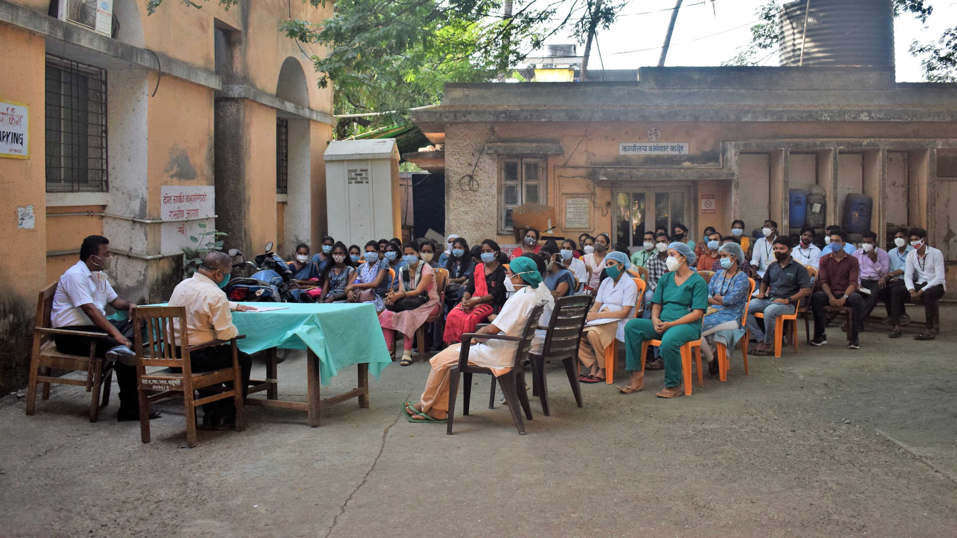 Medical staff are briefed at the Government Rural Hospital in Palghar, India.