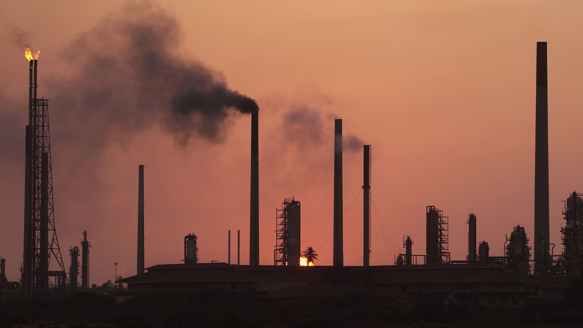 willemstad, curacao, dutch antilles, old oil refinery at dusk, pollution of environment