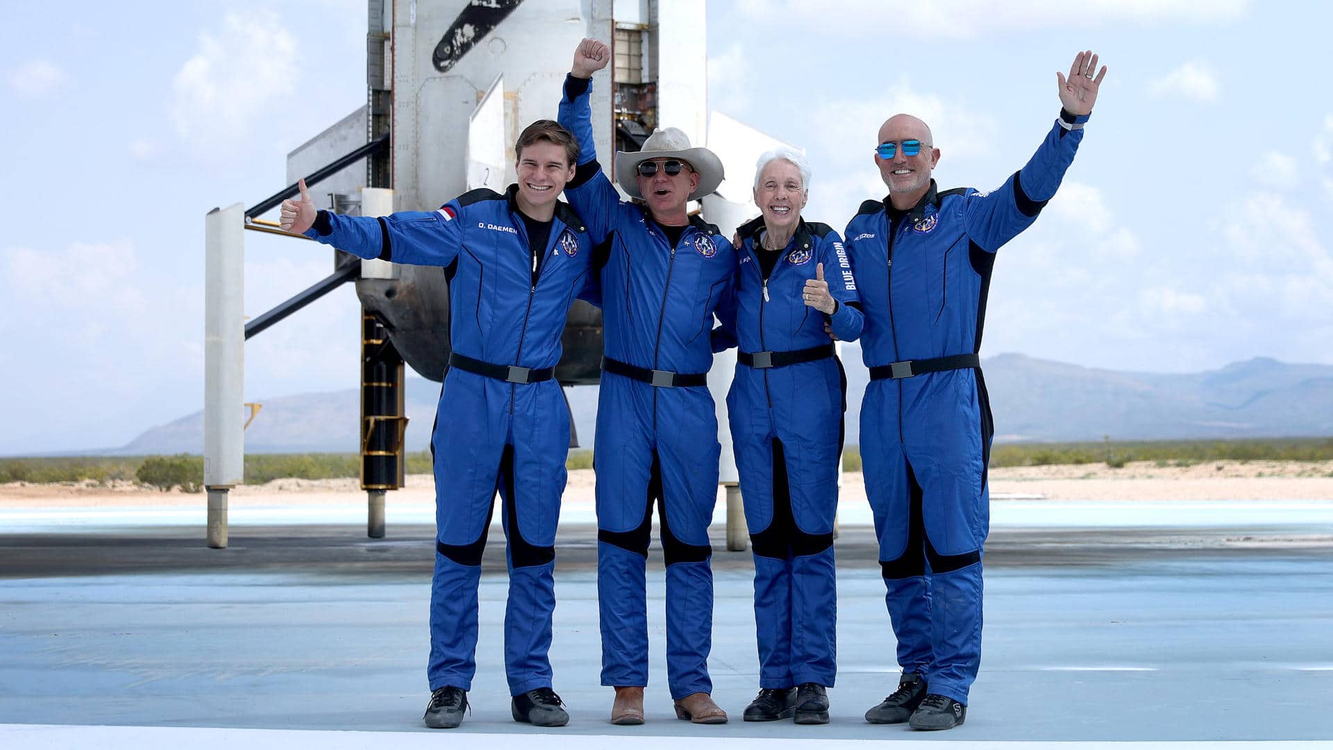 Blue Origin’s New Shepard crew (L-R) Oliver Daemen, Jeff Bezos, Wally Funk, and Mark Bezos pose for a picture after flying into space on July 20, 2021.