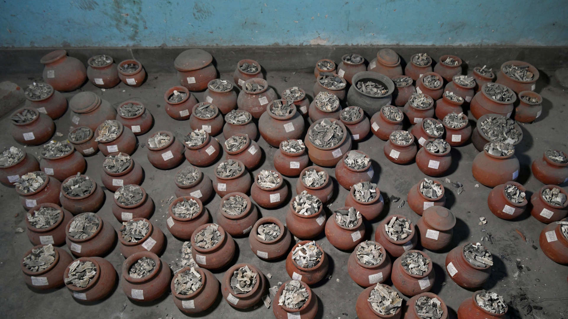 Unclaimed clay urns containing ashes of people who died due to Covid-19 lay on the ground at the Sumanahalli crematorium in the suburbs of Bengaluru, (formerly Bangalore), India on June 1, 2021.
