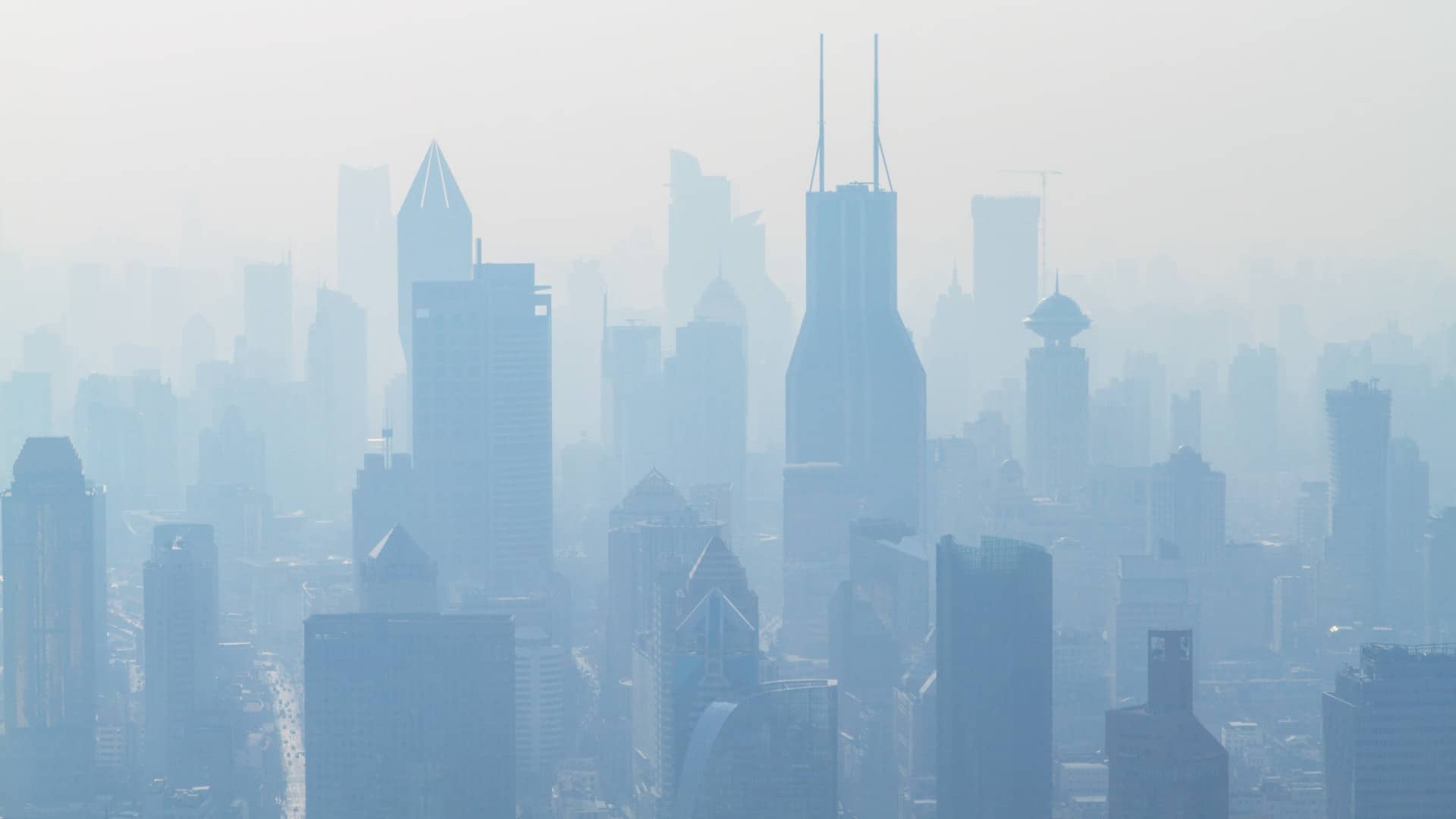 The Shanghai skyline under a haze of air pollutants.