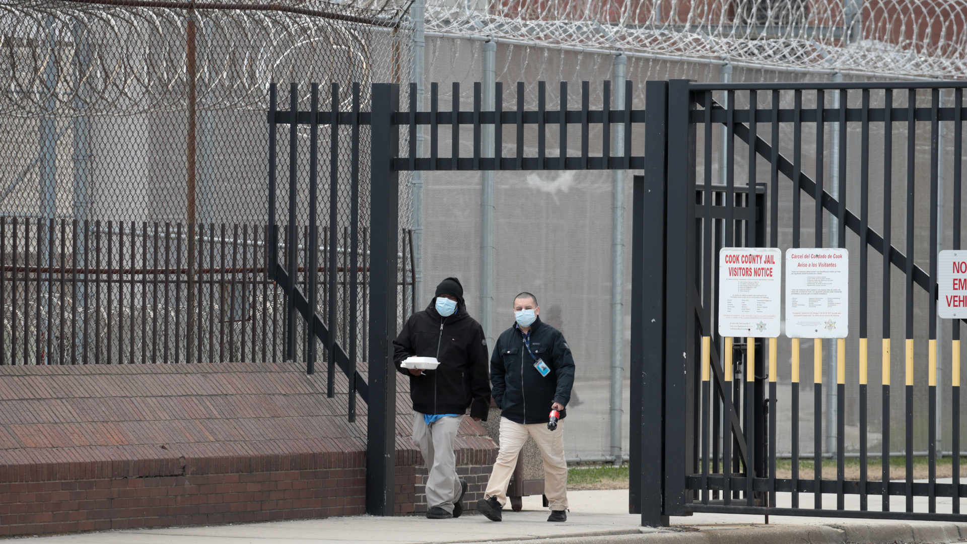 In Chicago, people wearing protective masks leave the Cook County jail complex in April 2020.