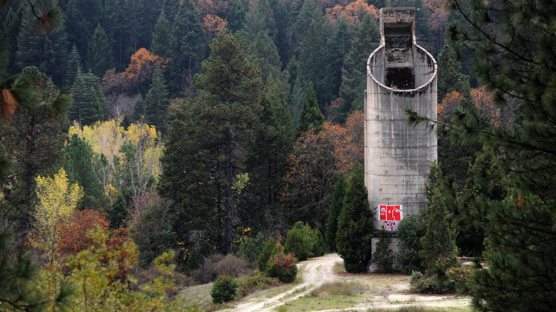 The site of an abandoned mine near Grass Valley, California, is marked by a weathered concrete silo. All visuals by BECKI ROBINS for UNDARK
