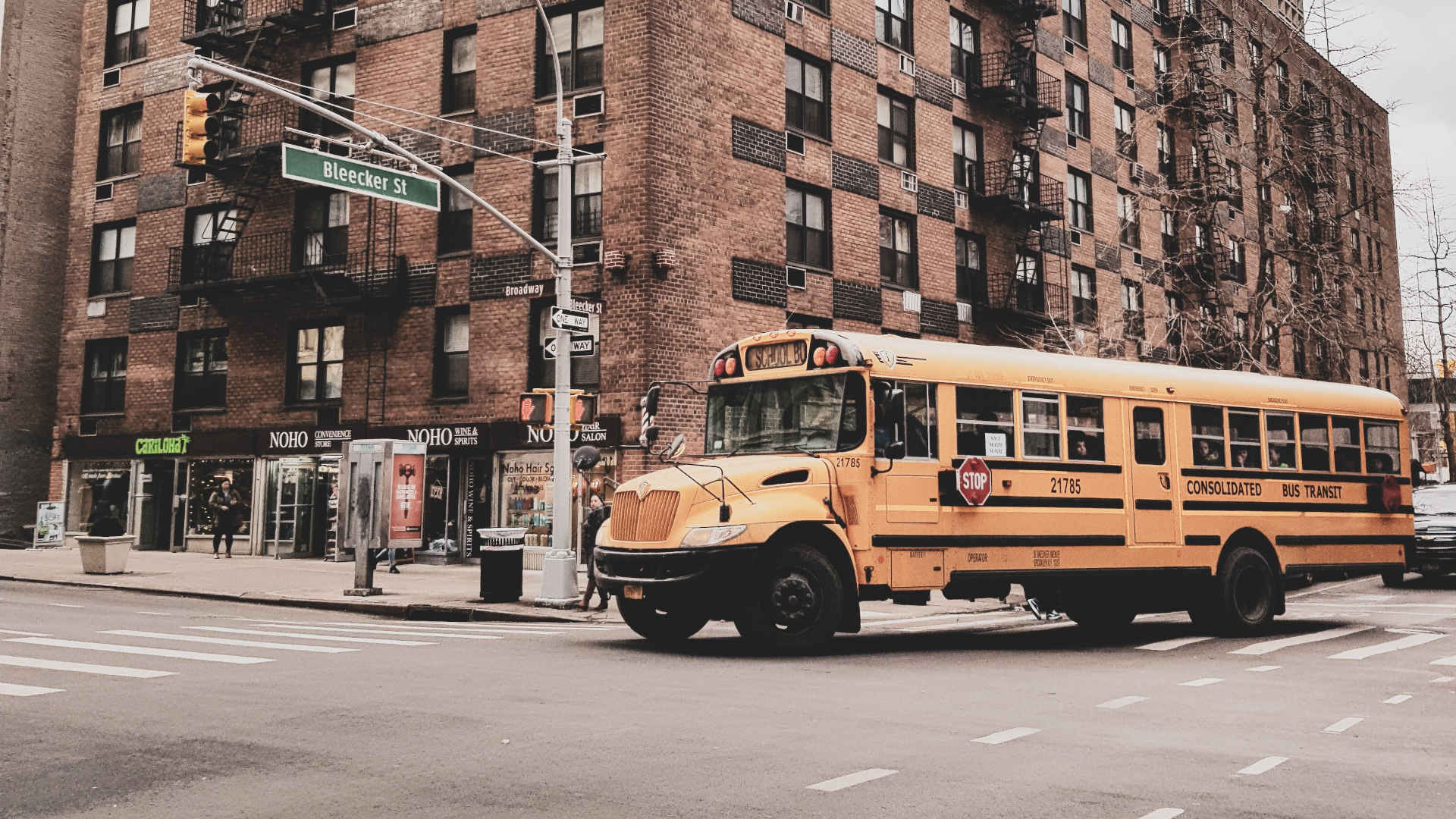 A school bus drives through New York City.