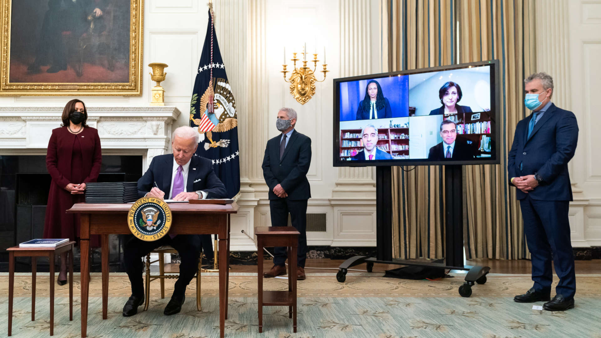 President Joe Biden, joined by Vice President Kamala Harris, Anthony Fauci, and Jeff Zients signs an executive order on Establishing the Covid-19 Pandemic Testing Board.