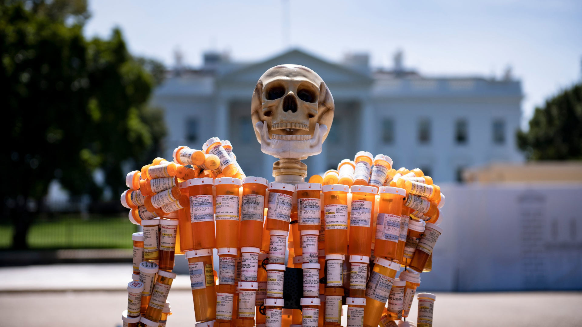 Pill Man, a skeleton made from oxycontin and methadone prescription bottles, is seen on Pennsylvania Avenue in front of the White House in 2019.