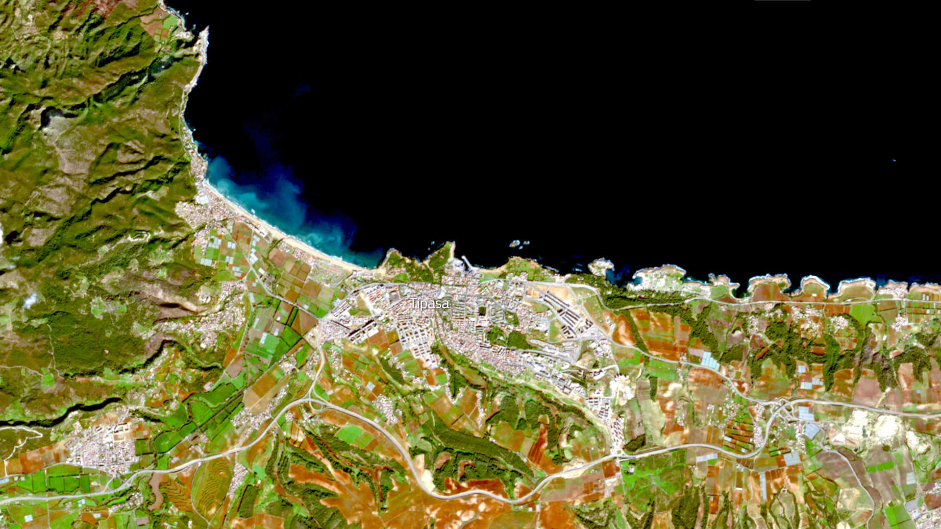 A satellite image from February 8, 2022, shows the thin slice of the ancient ruins of Tipasa squeezed between the modern city of Tipaza and the Mediterranean Sea.