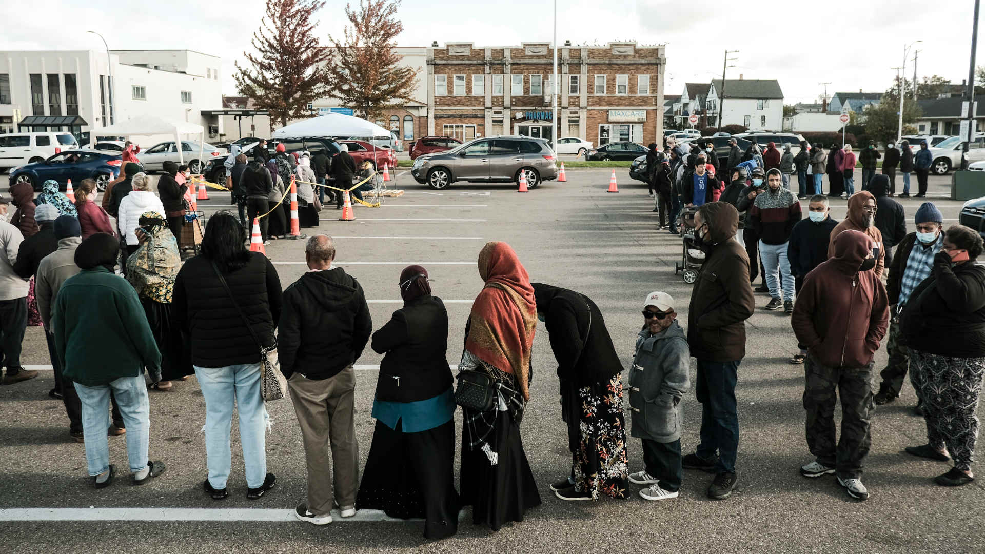 Residents of Hamtramck, Michigan, wait in long lines to receive a water filter after elevated levels of lead were found in the drinking water in Oct. 2021.