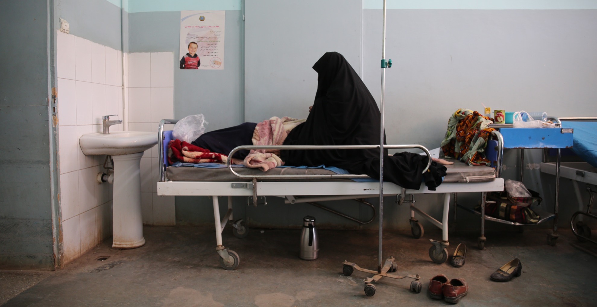 A female patient who has been diagnosed with conversion disorder on the female ward at Herat Regional Hospital's Psychiatric Department in Herat Province, Afghanistan. ALL VISUALS BY LYNZY BILLING