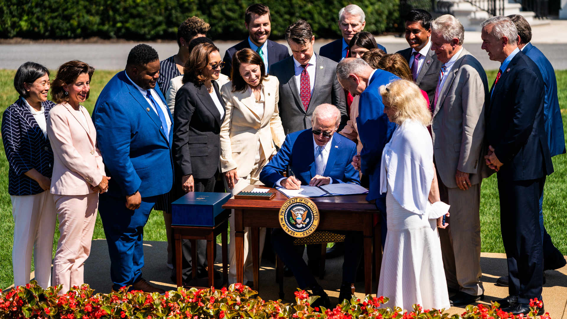On the South Lawn of the White House in August, President Joe Biden signs into law the CHIPS and Science Act of 2022.