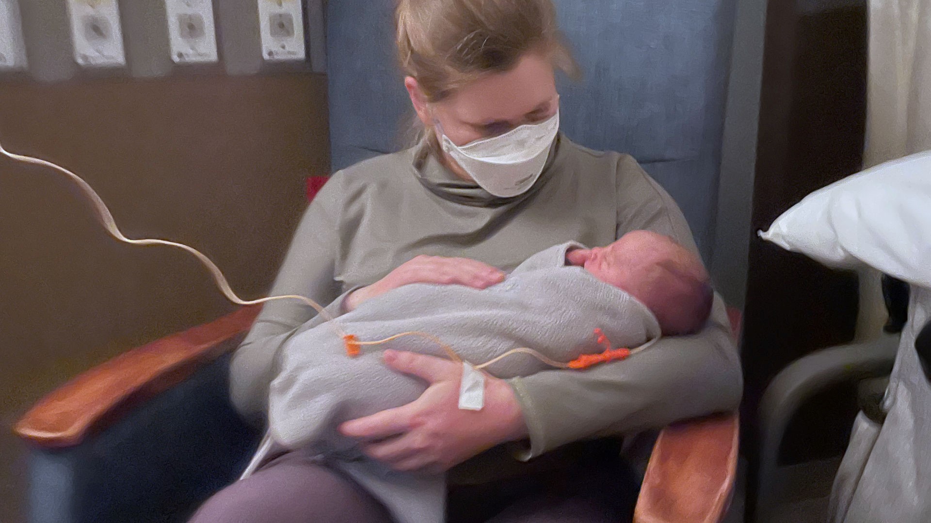 Amanda Grennell holds her newborn son in the hospital, May 2022. Like many breastfeeding parents, she would later experience mastitis.