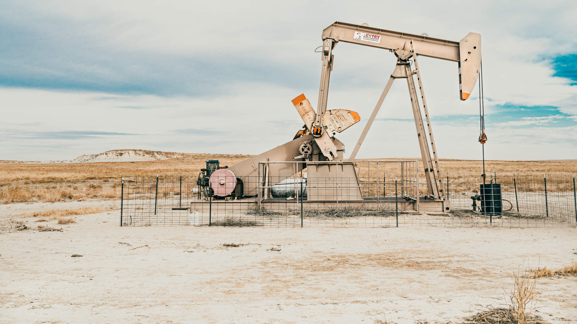A pump jack extracts oil from a well.