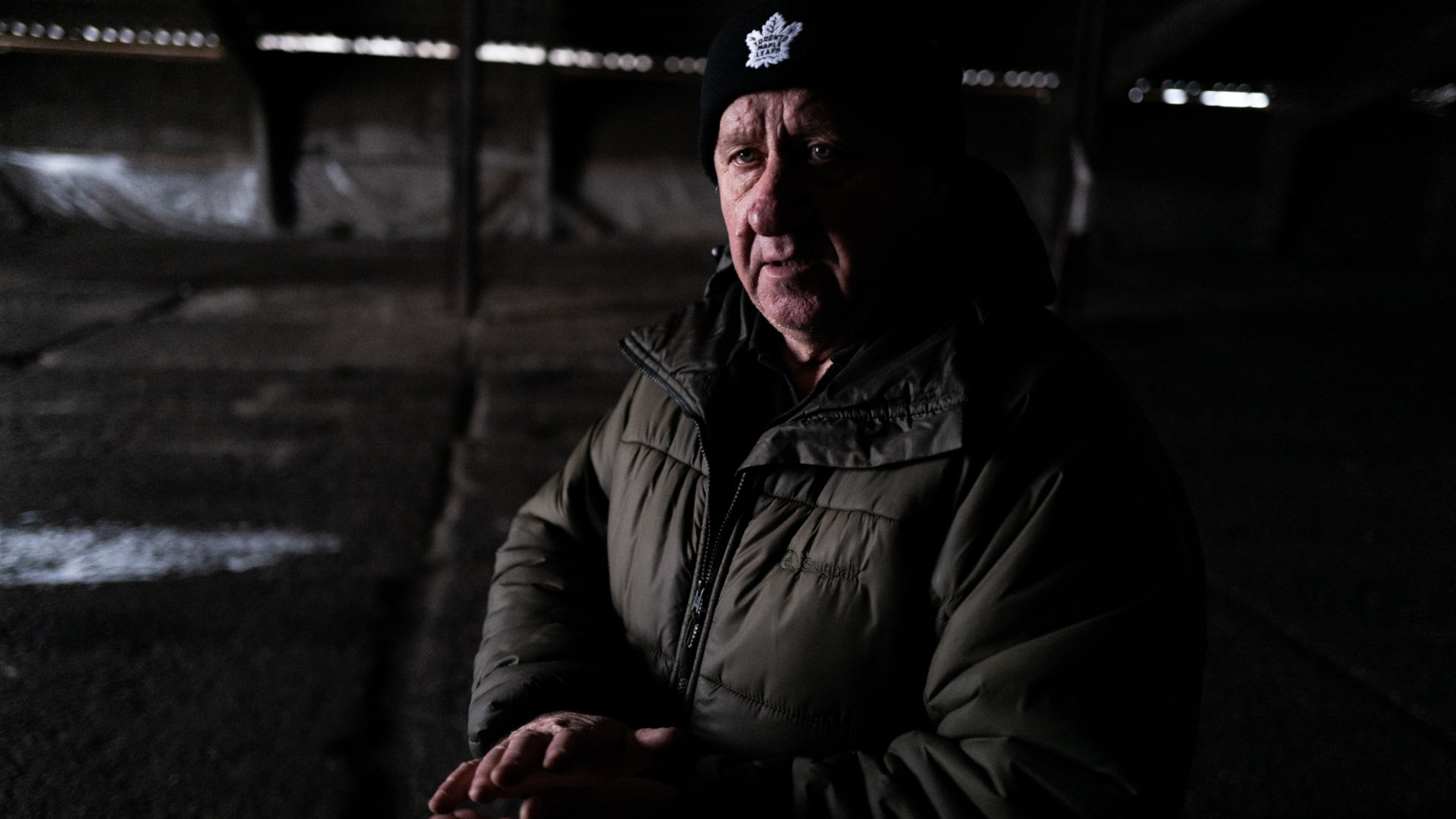 Ukrainian farmer Lyonid Lysachenko describes how a Russian rocket crashed through the roof of his warehouse, destroying a large portion of the grain inside. |  All photos by KERN HENDRICKS for UNDARK