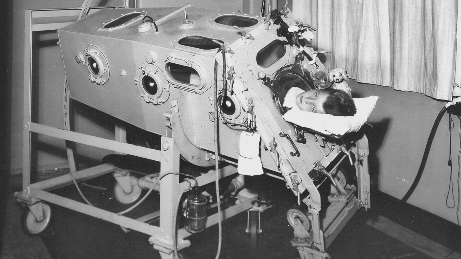 A child is treated in an early version of the iron lung at Children’s Hospital Boston in 1932.