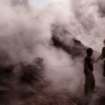 Tourists visit the Solfatara crater, part of the Phlegraean Fields, an active volcano near Naples, Italy.