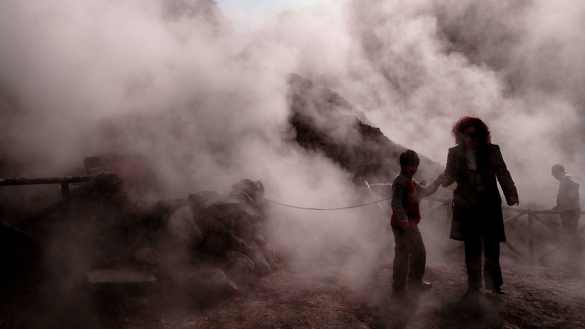 Tourists visit the Solfatara crater, part of the Phlegraean Fields, an active volcano near Naples, Italy.