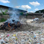 A plastic dump, full of foreign waste, near a paper mill in East Java, Indonesia.