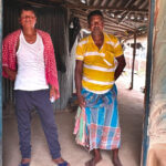 Sanjeet Pahan (left) and his brother (right) at Pahan’s home in a village in West Bengal, India. Pahan has an extreme case of post-kala-azar dermal leishmaniasis.