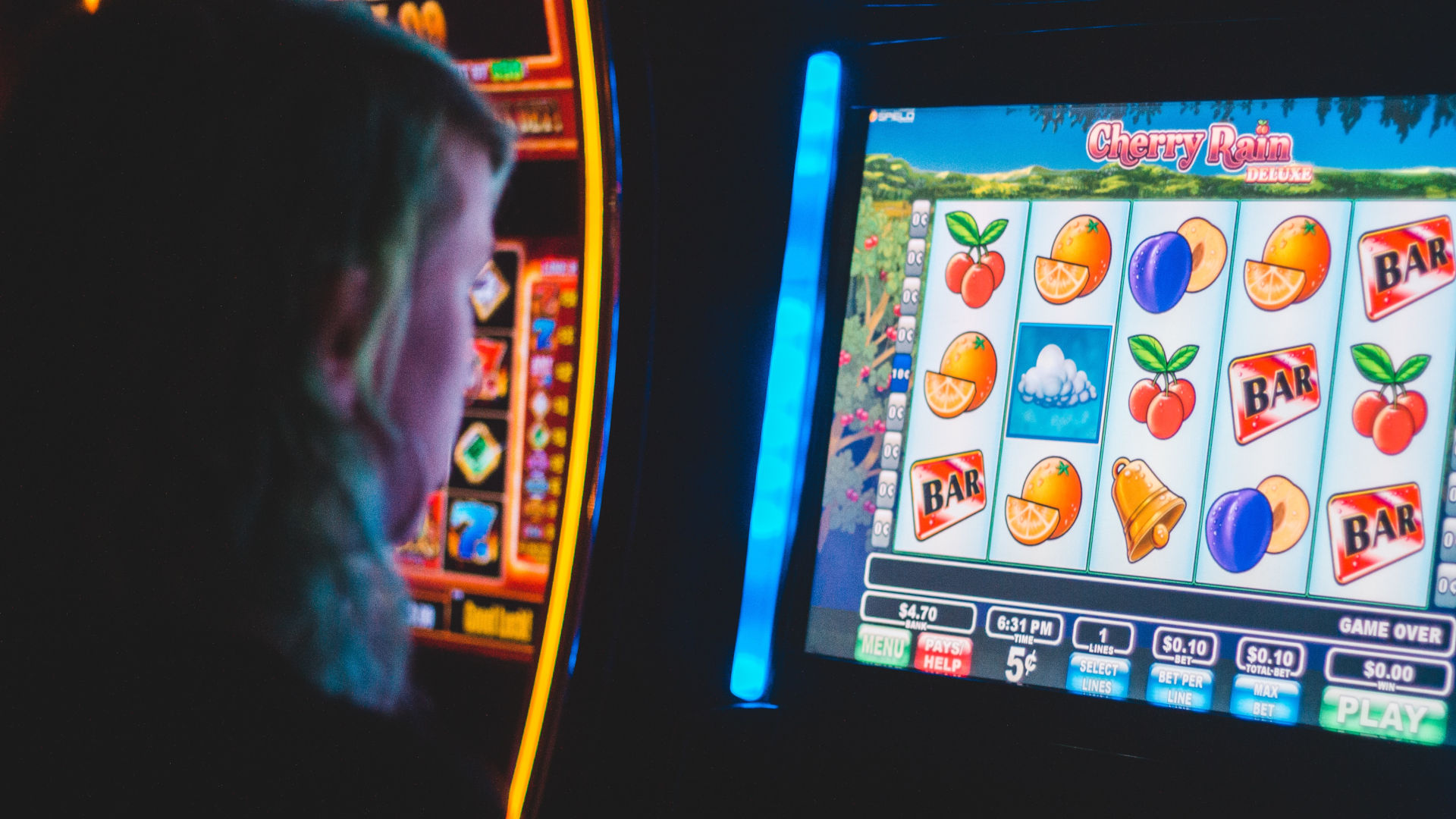 a person plays a slot machine