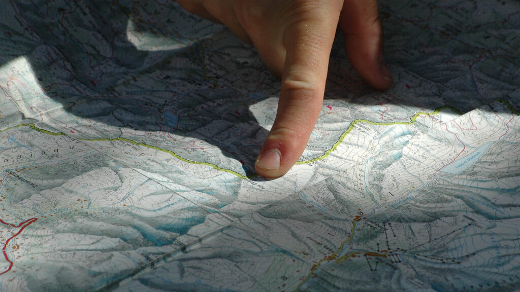 a finger point out road on a map