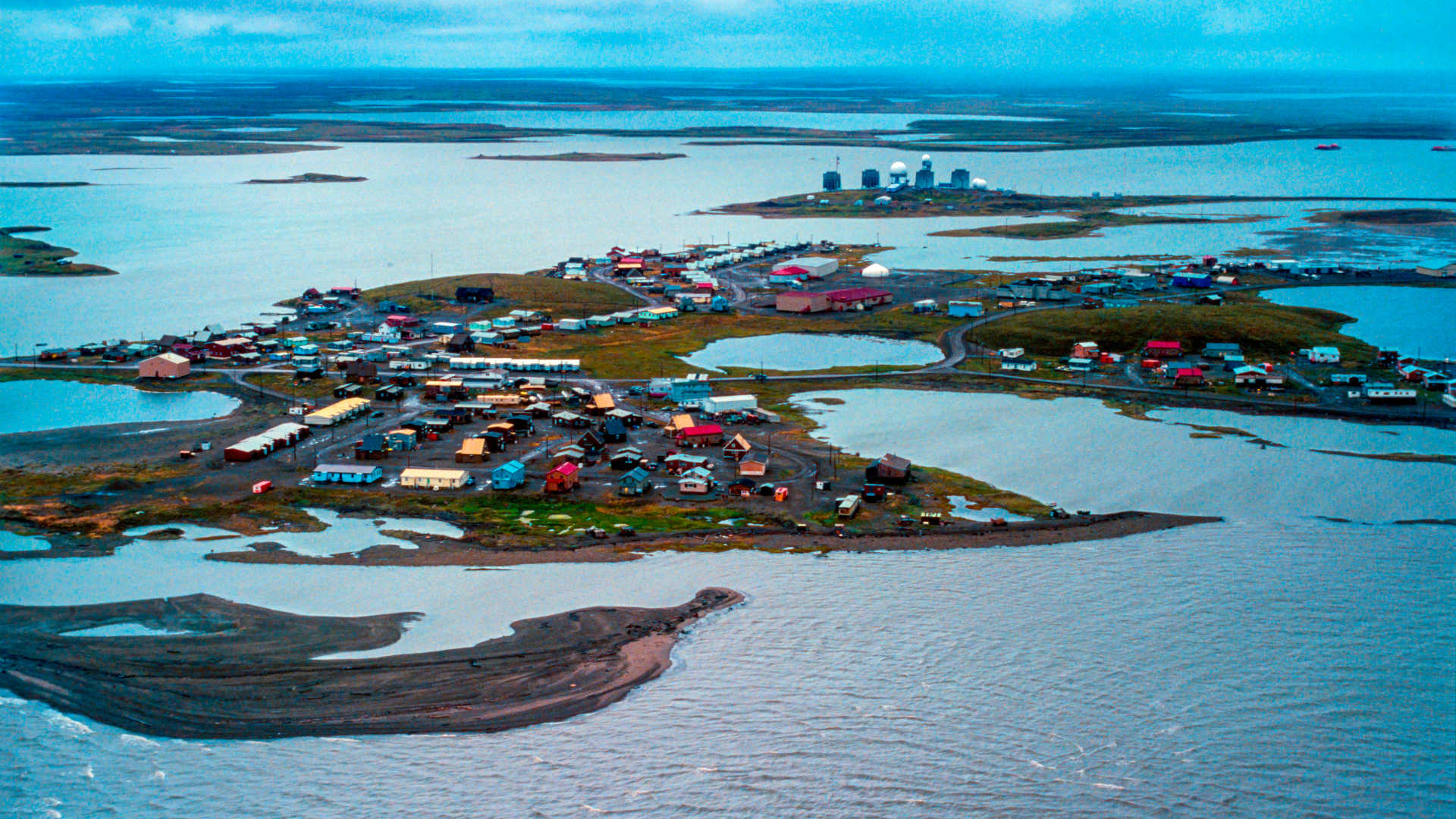 An aerial view of Tuktoyaktuk, a small hamlet in the Northwest Territories of Canada, and the Mackenzie River delta in the summer.
