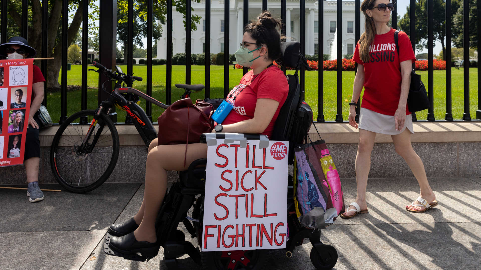 In 2022, protestors march outside the White House to call attention to those with ME/CFS and long Covid.