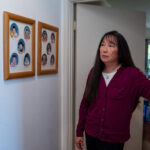 Angela Tang, whose son came down with a baffling illness several years ago, looks at baby pictures of her three children at their home in the Los Angeles suburbs.