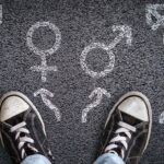 teenager shoes and sex symbols on asphalt