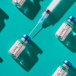 Covid 19 coronavirus vaccine vials with syringe repetition pattern with trendy lighting on teal background